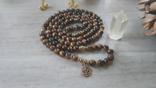 Load and play video in Gallery viewer, TIGER EYE Mala 108 Beads. Healing crystals handmade. Meditation spiritual jewelry. Reiki energy Chakra healing. Tiger eye bracelet beads
