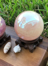 Load and play video in Gallery viewer, Angel Aura Rose Quartz Sphere. Large Healing Metaphysical Crystal with handmade wooden Base. Home Decor Crystals Meditation Reiki, Wicca
